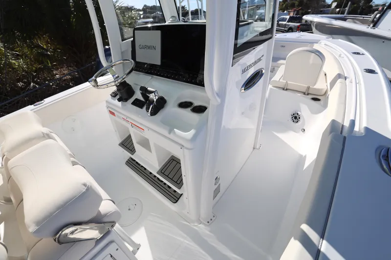 Slide: The Image of Interior view of 2026 Sea Hunt Ultra 265 SE boat with Garmin navigation system. - 24