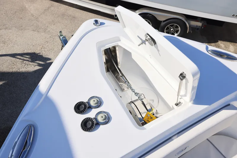 Slide: The Image of Bow storage compartment of 2026 Sea Hunt Ultra 265 SE boat, featuring anchor and chain. - 28