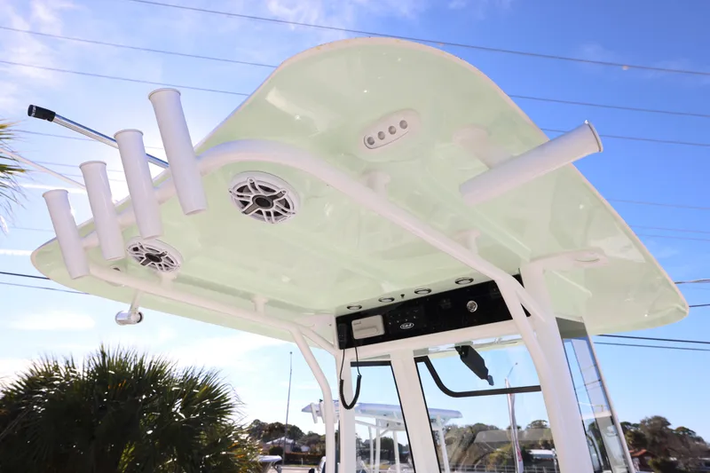 Slide: The Image of 2026 Sea Hunt Ultra 265 SE boat top with rod holders and speakers. - 7