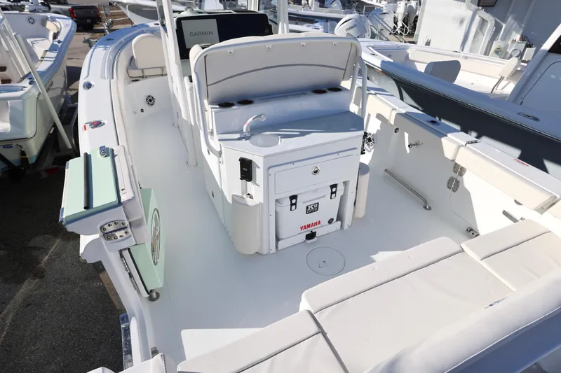 Slide: The Image of 2026 Sea Hunt Ultra 265 SE boat interior with seating and console. - 8