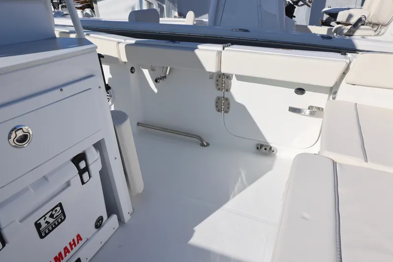 Slide: The Image of 2026 Sea Hunt Ultra 265 SE boat interior with seating and storage. - 9