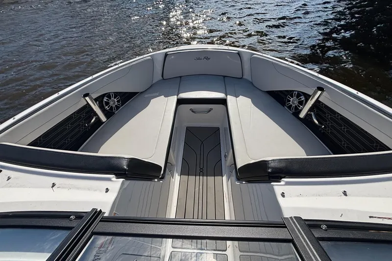 Slide: The Image of 2025 Sea Ray 21 SPX OB boat interior with sleek seating and modern design on water. - 18