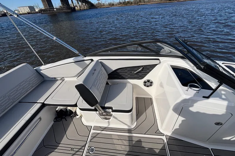Slide: The Image of 2025 Sea Ray 21 SPX OB boat interior with seating and water view. - 20