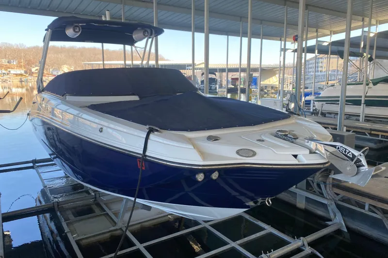 The Image of 2022 Monterey M-65 boat docked under a covered marina. - 1