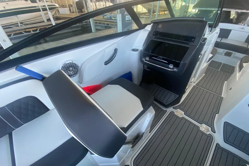 Slide: The Image of 2022 Monterey M-65 boat interior with sleek seating and modern dashboard design. - 10