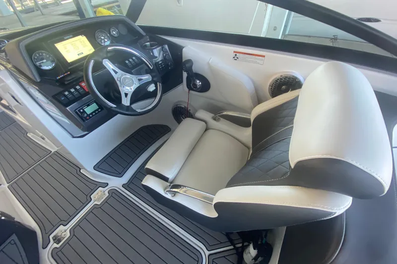 Slide: The Image of Interior of 2022 Monterey M-65 boat with steering wheel and captain's seat. - 12