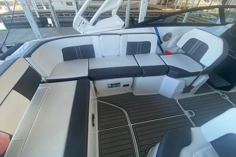 Slide: The Image of 2022 Monterey M-65 boat interior with sleek seating and modern design. - 13