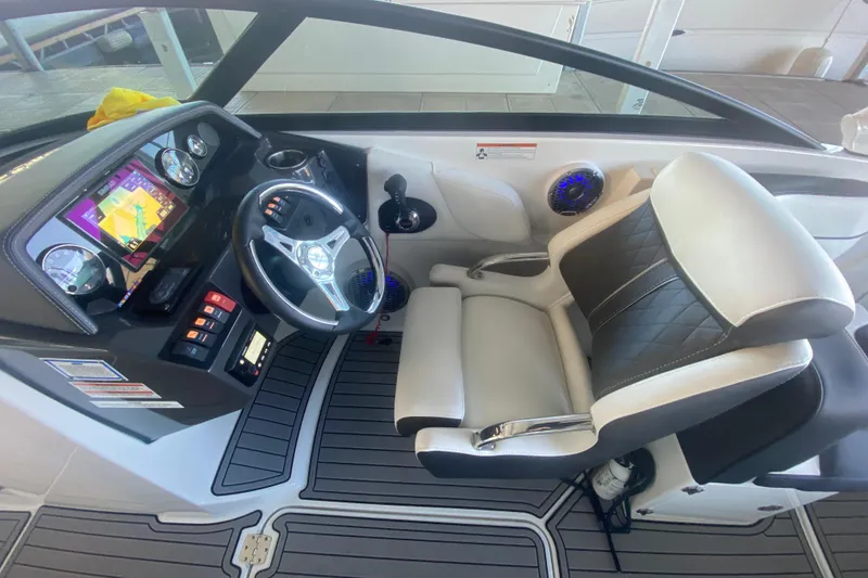 Slide: The Image of Cockpit of 2022 Monterey M-65 boat with modern controls and comfortable seating. - 25