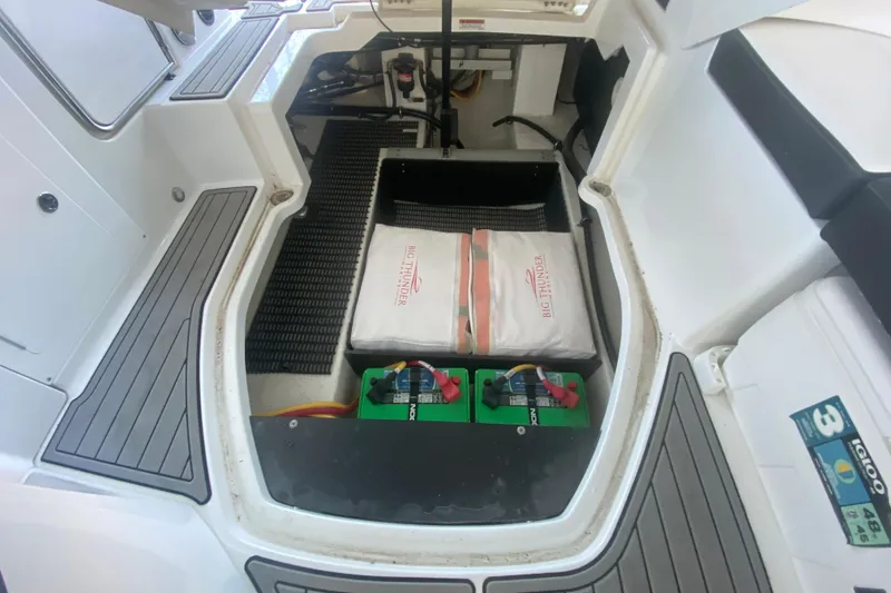 Slide: The Image of 2022 Monterey M-65 boat storage compartment with batteries and equipment. - 26