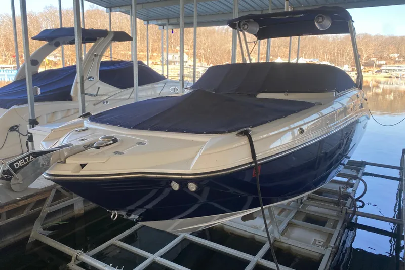 Slide: The Image of 2022 Monterey M-65 boat docked, covered, and ready for use. - 27