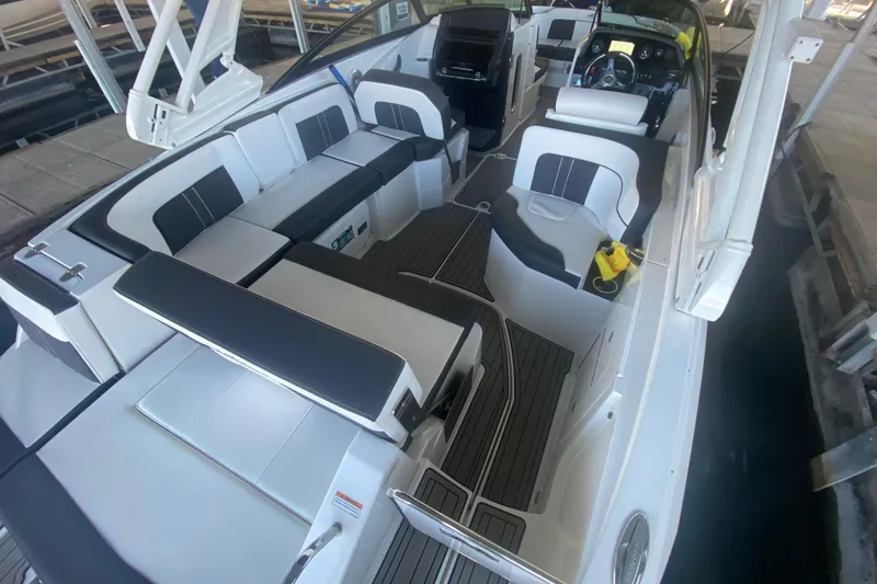 Slide: The Image of 2022 Monterey M-65 boat interior with sleek seating and modern design. - 5