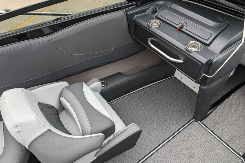Slide: The Image of 2024 Crownline 240 SS LPX boat interior with gray seating and textured flooring. - 8
