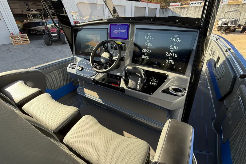 Slide: The Image of 2026 Sunsation 34 CCX boat cockpit with modern dashboard and seating. - 10