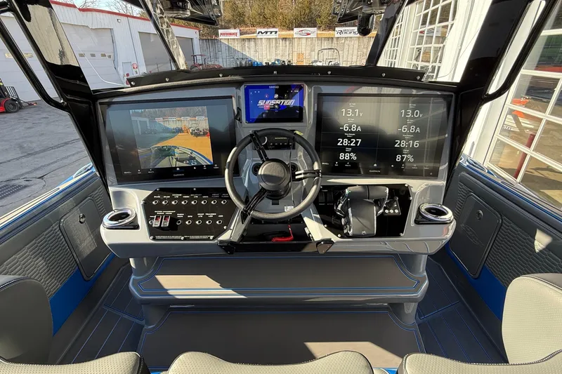 Slide: The Image of 2026 Sunsation 34 CCX boat dashboard with advanced navigation and control systems. - 11