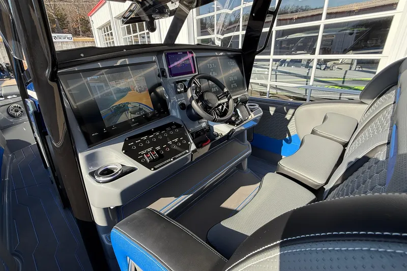 Slide: The Image of 2026 Sunsation 34 CCX boat cockpit with advanced navigation and control systems. - 12
