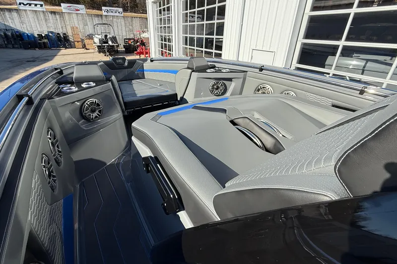 Slide: The Image of 2026 Sunsation 34 CCX boat interior with sleek seating and advanced audio system. - 15