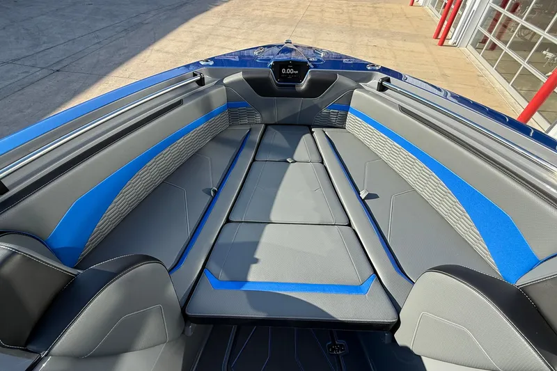 Slide: The Image of 2026 Sunsation 34 CCX boat interior with sleek gray and blue seating design. - 16