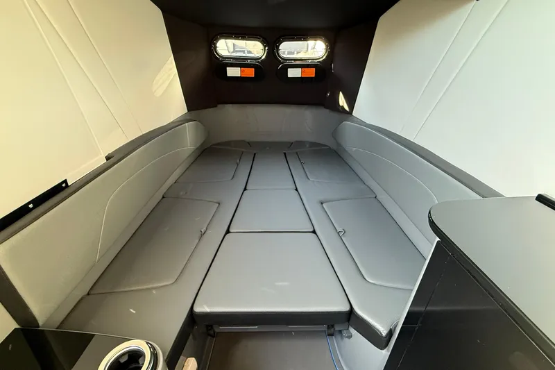 Slide: The Image of Interior cabin of 2026 Sunsation 34 CCX boat, featuring sleek seating and modern design. - 21