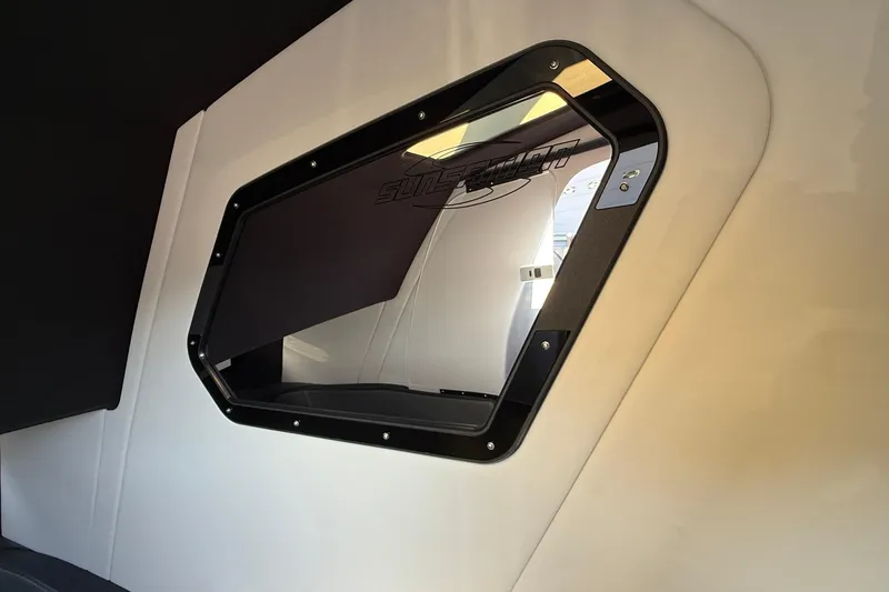 Slide: The Image of Interior view of 2026 Sunsation 34 CCX boat window with sleek design. - 26