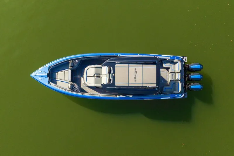 Slide: The Image of Aerial view of 2026 Sunsation 34 CCX boat on green water. - 38