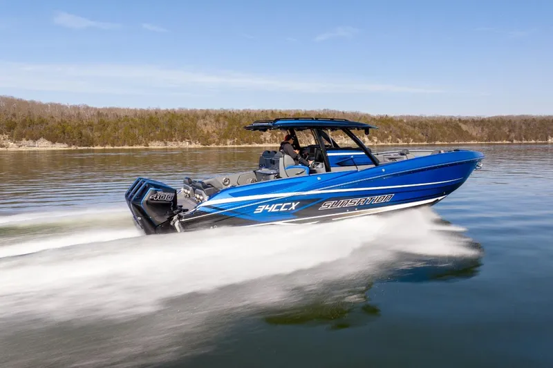 Slide: The Image of 2026 Sunsation 34 CCX speedboat cruising on a calm lake. - 42