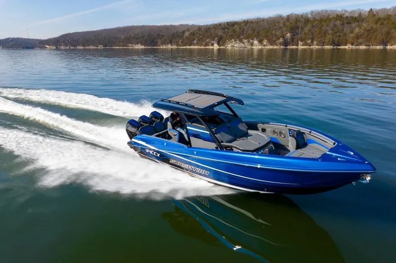 Slide: The Image of 2026 Sunsation 34 CCX speedboat cruising on a serene lake. - 46