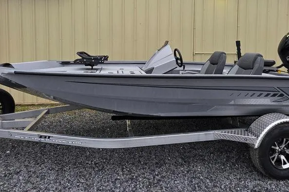 Slide: The Image of 2026 Xpress H17C Crappie boat on trailer, sleek gray design, dual seats. - 11