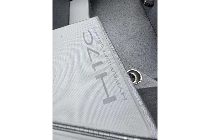 Slide: The Image of 2026 Xpress H17C Crappie boat interior detail with Hyper-Lift branding. - 16