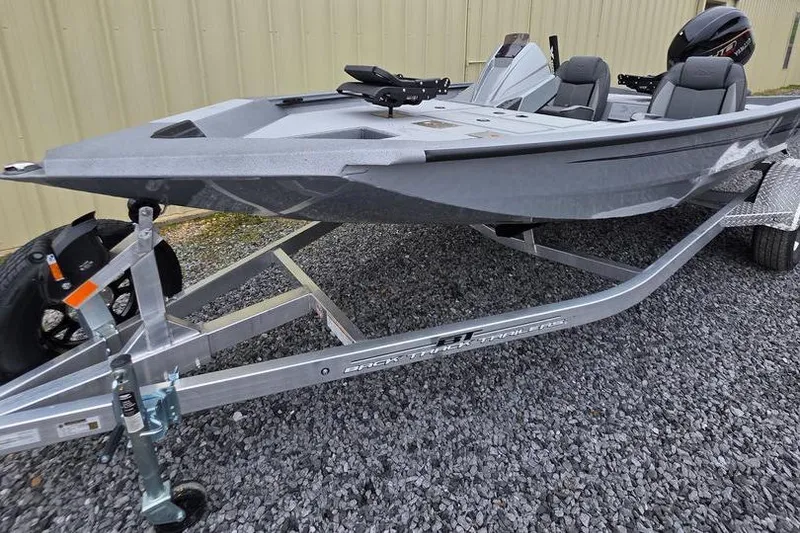 Slide: The Image of 2026 Xpress H17C Crappie boat on trailer, parked on gravel surface. - 24