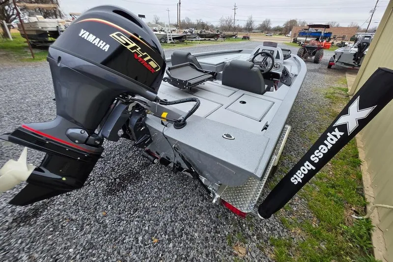 Slide: The Image of 2026 Xpress H17C Crappie boat with Yamaha engine, displayed outdoors. - 4