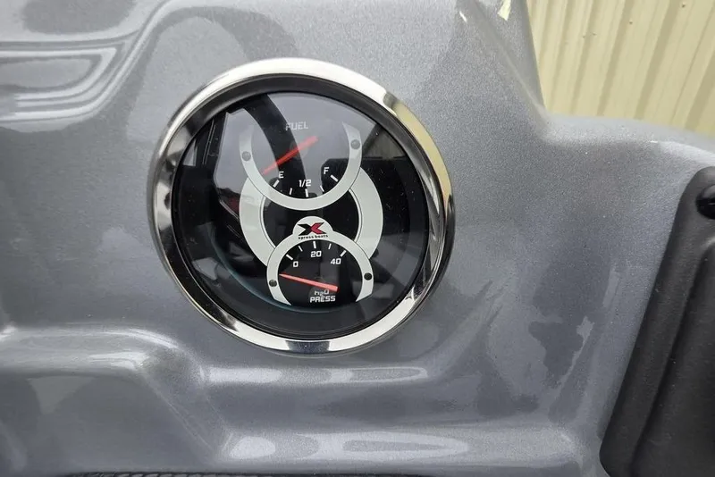 Slide: The Image of Dashboard gauges of 2026 Xpress H17C Crappie boat, showing fuel and pressure levels. - 6