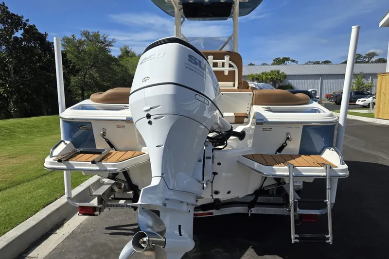 Slide: The Image of 2026 Pioneer 222 Islander boat with powerful outboard motor and swim platforms. - 2