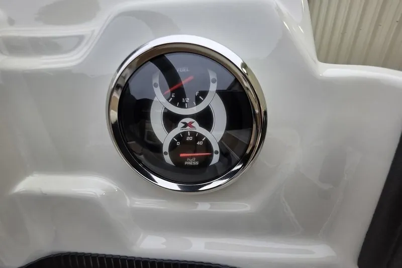 Slide: The Image of Close-up of 2026 Xpress H18C Crappie boat gauges on a white dashboard. - 10