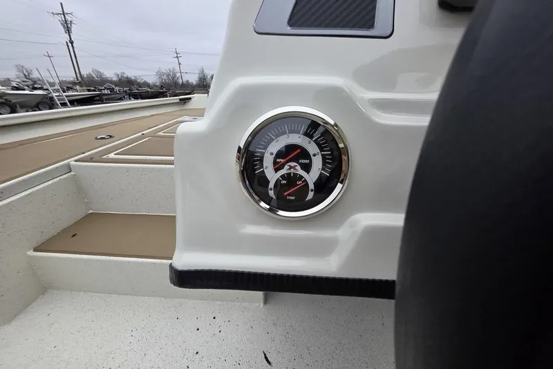 Slide: The Image of 2026 Xpress H18C Crappie boat dashboard with gauge, showcasing modern design. - 11
