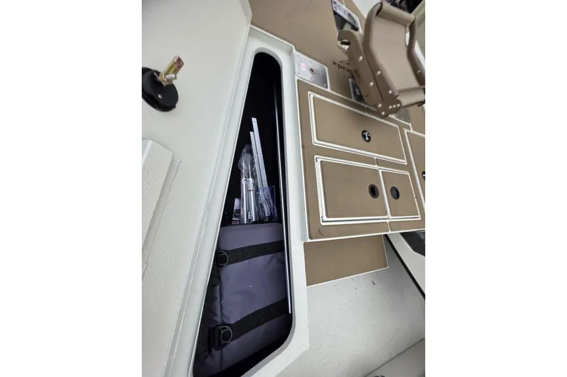 Slide: The Image of 2026 Xpress H18C Crappie boat interior storage and seating area. - 17