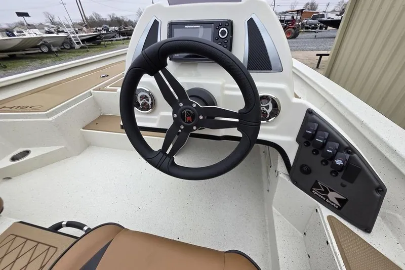 Slide: The Image of Steering console of 2026 Xpress H18C Crappie boat with modern controls and dashboard. - 4