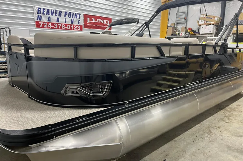 The Image of 2026 Tahoe Pontoon Sport 85 Versatile Rear Bench 23 in showroom, side view. - 0