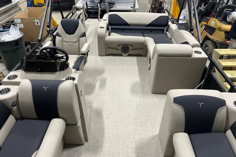 Slide: The Image of 2026 Tahoe Pontoon Sport 85 Versatile Rear Bench 23 interior with luxurious seating and steering console. - 14
