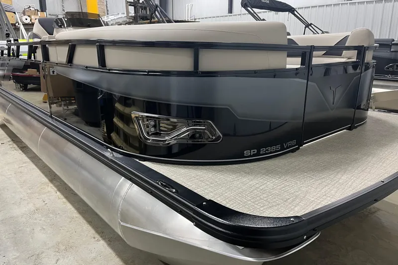 Slide: The Image of 2026 Tahoe Pontoon Sport 85 Versatile Rear Bench 23 in a showroom setting. - 2
