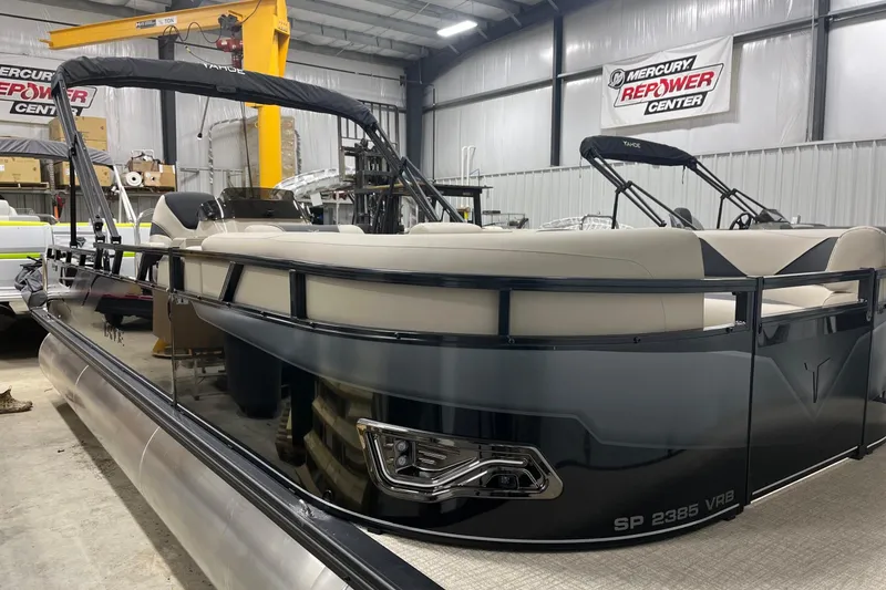 Slide: The Image of 2026 Tahoe Pontoon Sport 85 Versatile Rear Bench 23 in a showroom setting. - 3