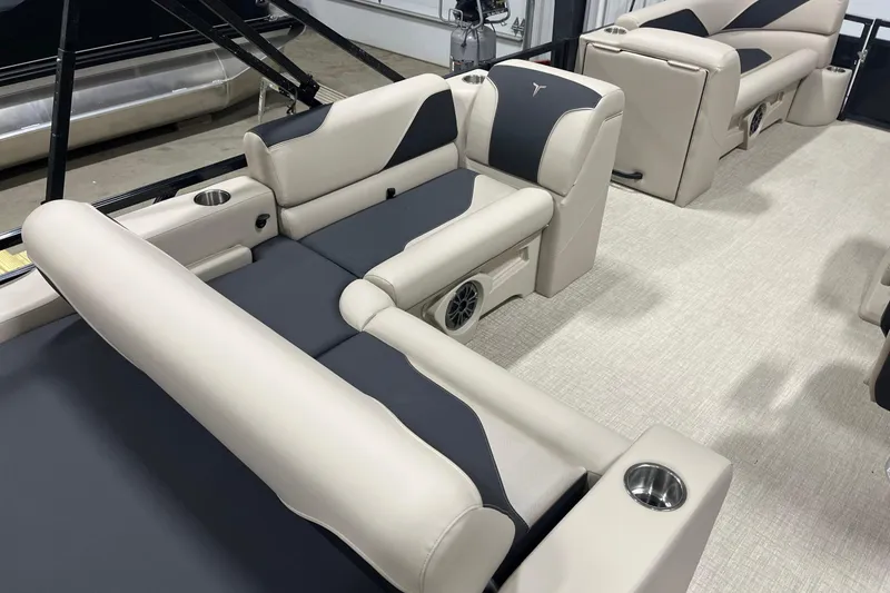 Slide: The Image of 2026 Tahoe Pontoon Sport 85 Versatile Rear Bench 23 interior with beige and black seating. - 8