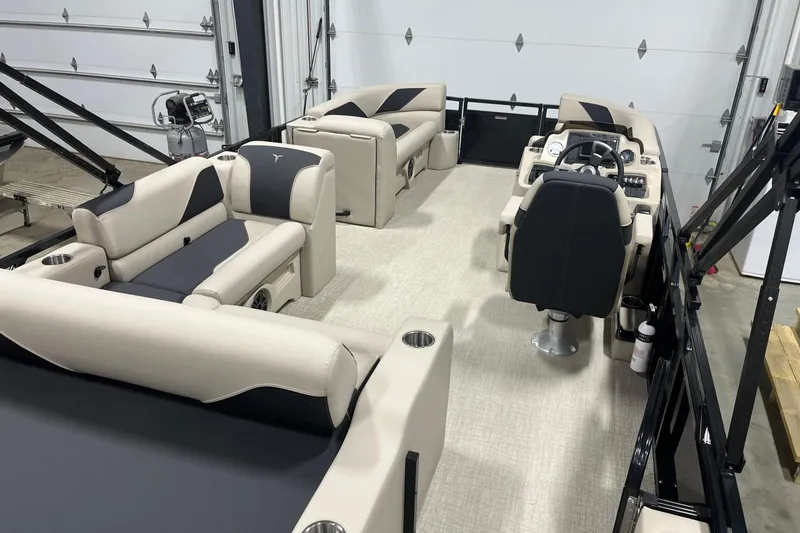 Slide: The Image of 2026 Tahoe Pontoon Sport 85 Versatile Rear Bench 23 interior with luxurious seating and helm. - 9