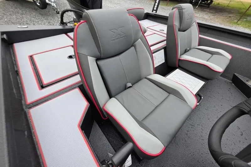 Slide: The Image of 2026 Xpress H17 boat interior with gray and red seats, modern design. - 10