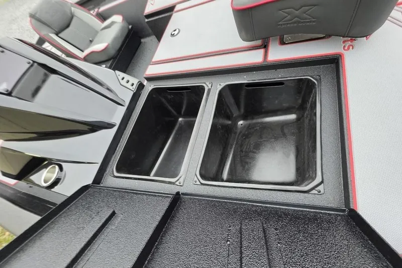 Slide: The Image of 2026 Xpress H17 boat interior with dual storage compartments and seating. - 17