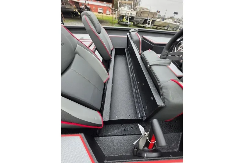 Slide: The Image of 2026 Xpress H17 boat interior with gray and red seating, showcasing storage compartment. - 18