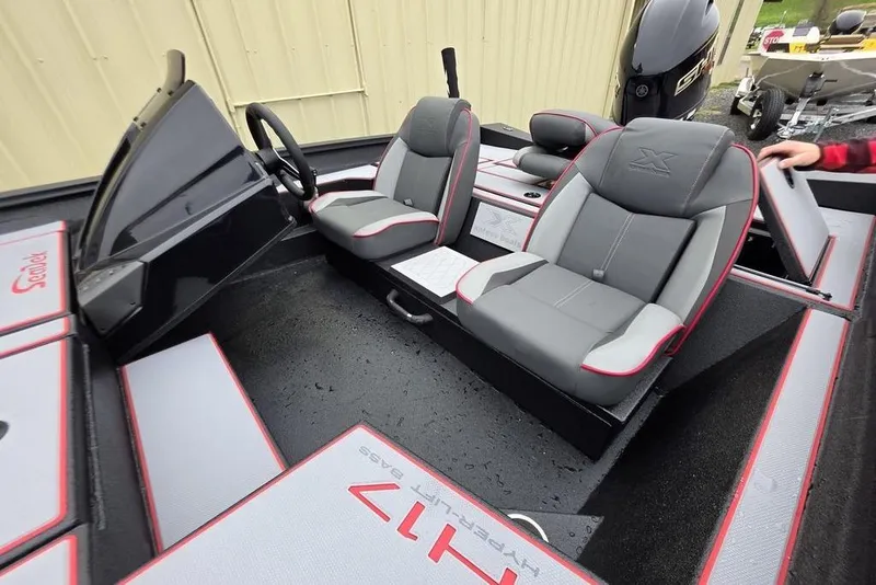 Slide: The Image of 2026 Xpress H17 boat interior with dual gray seats and steering wheel. - 19