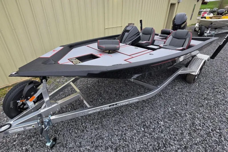 Slide: The Image of 2026 Xpress H17 boat on trailer, sleek design, gray and black color scheme. - 2