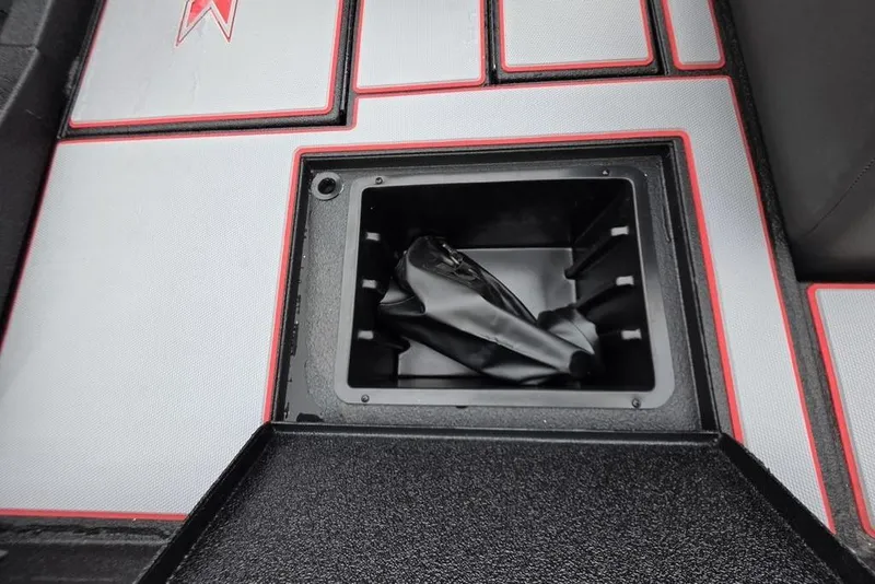Slide: The Image of 2026 Xpress H17 boat storage compartment with red and gray trim. - 5