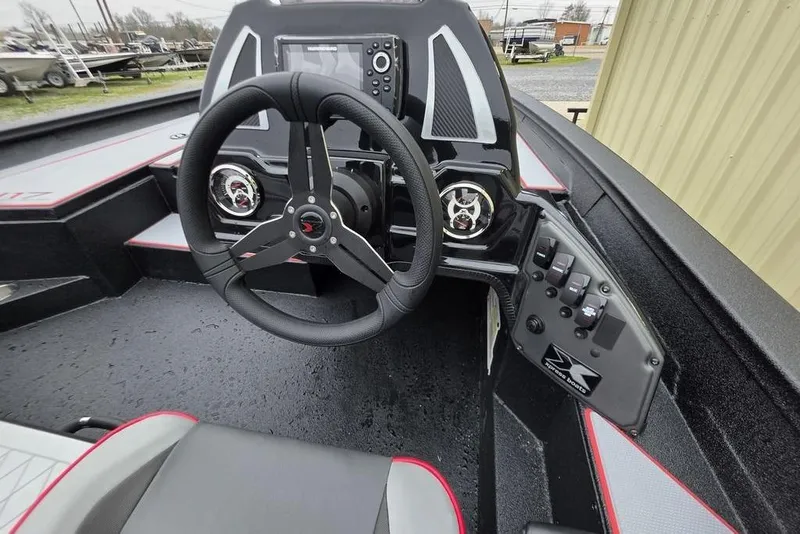 Slide: The Image of 2026 Xpress H17 boat cockpit with steering wheel and control panel. - 9