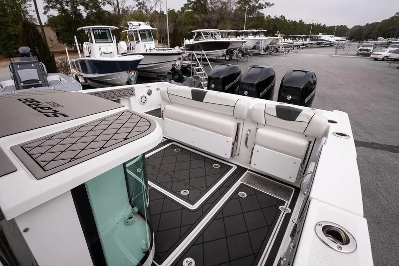 Slide: The Image of 2023 Wellcraft 352 Fisherman boat interior with seating and multiple outboard engines. - 14